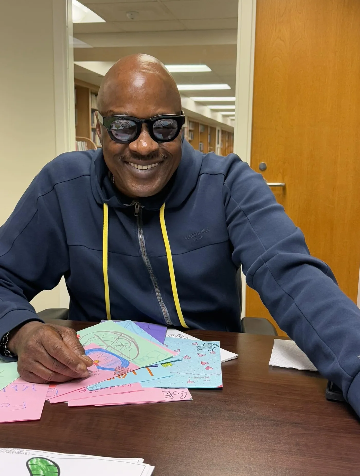 A volunteer making a card at a table
