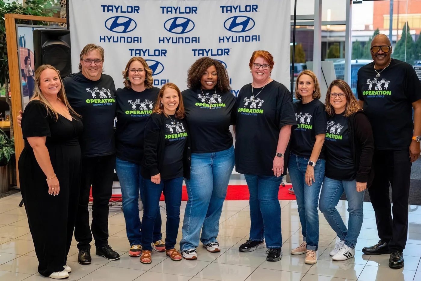 The Operation Surprise Attack board and volunteers at the Taylor Hyundai event