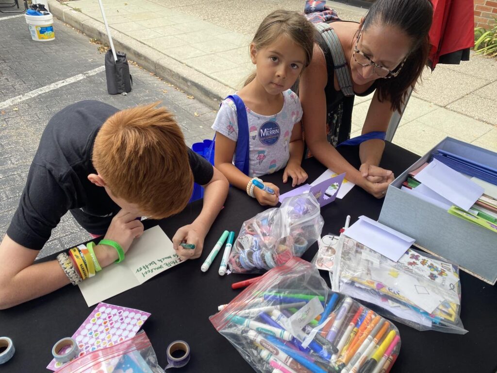 local kids creating cards during OSA card campaign