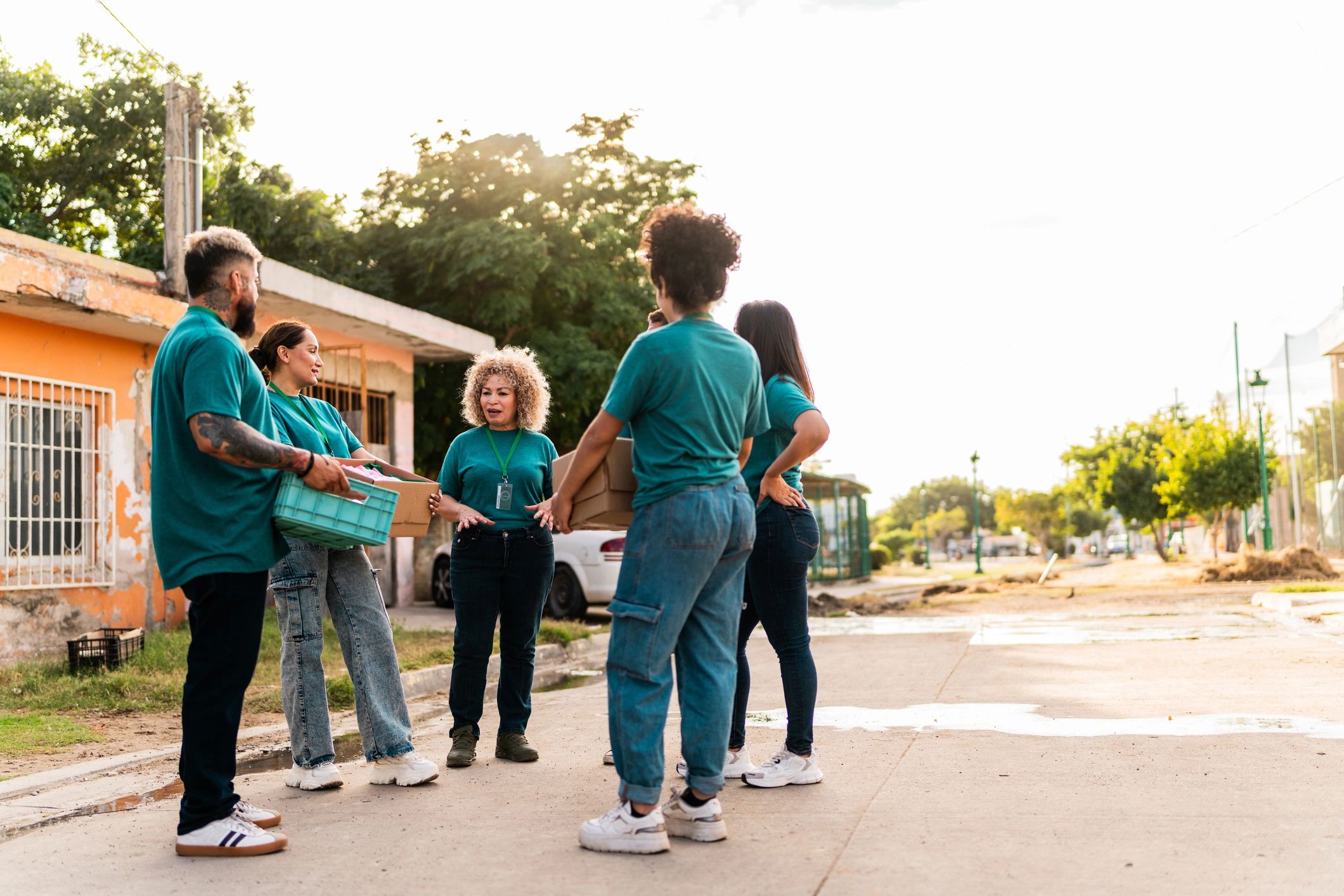 Volunteers holding donation boxes outdoors